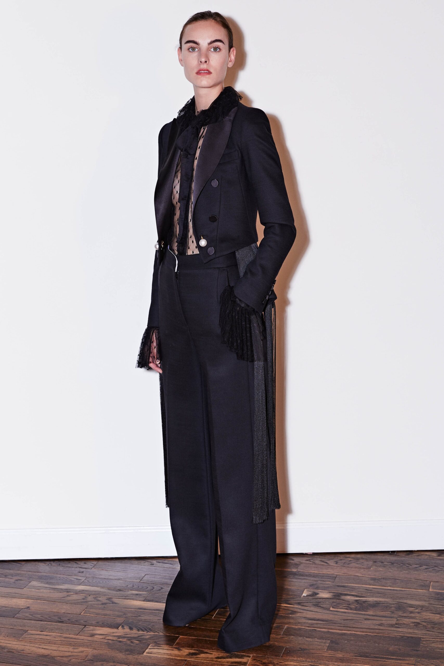 black tailored blazer with sheer blouse