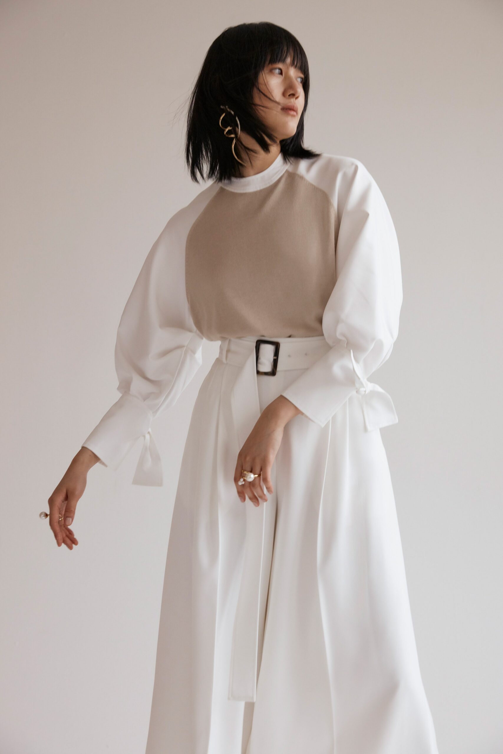 white relaxed blouse and fitted skirt