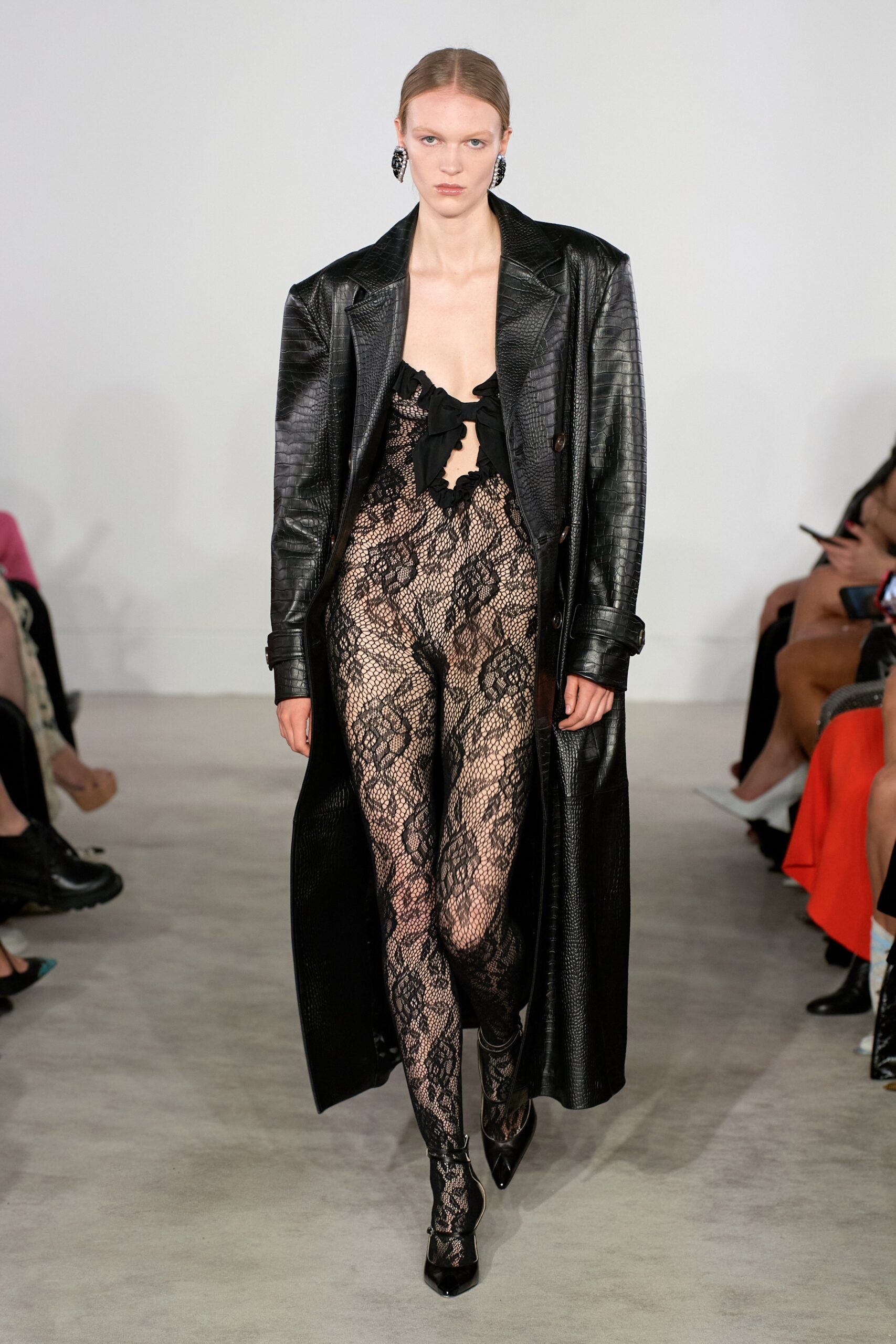 black leather coat and lace catsuit