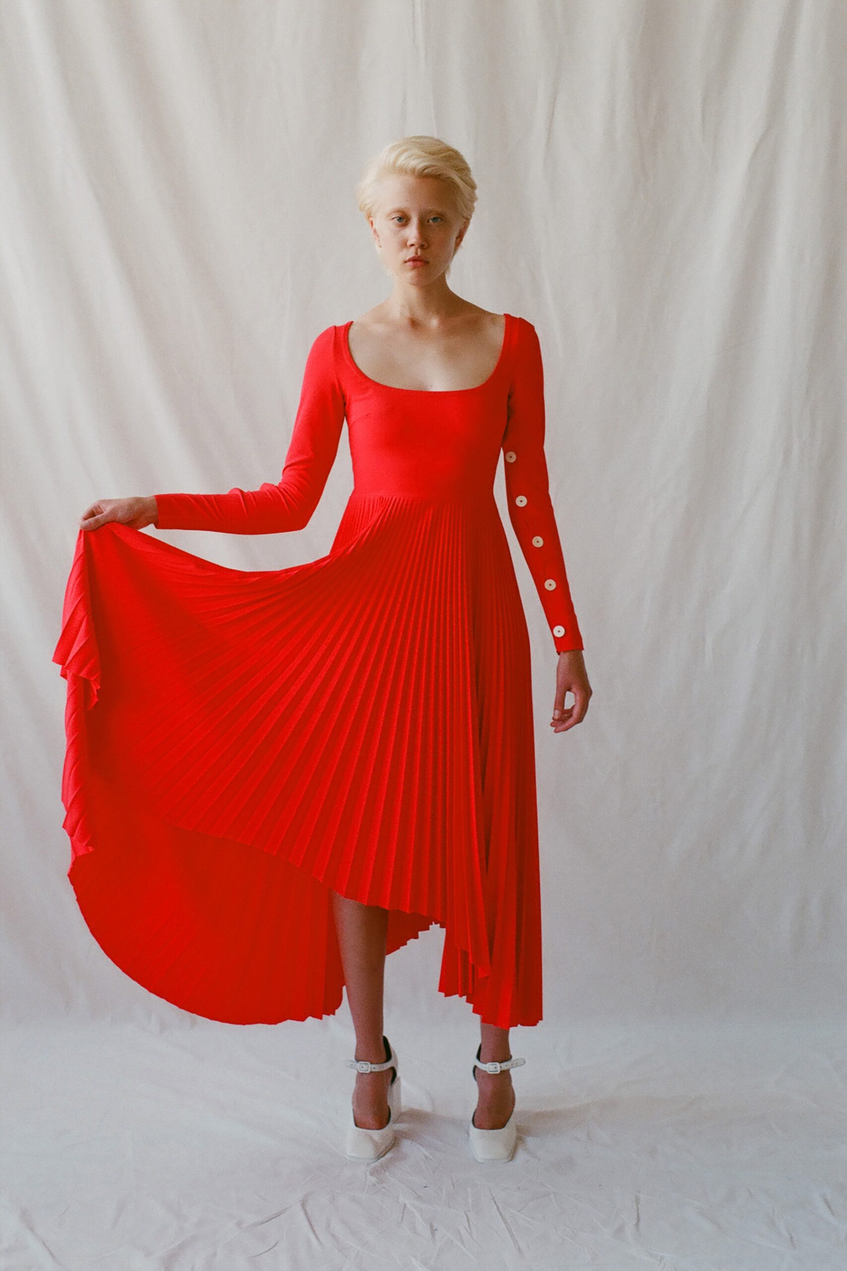red pleated long-sleeve dress