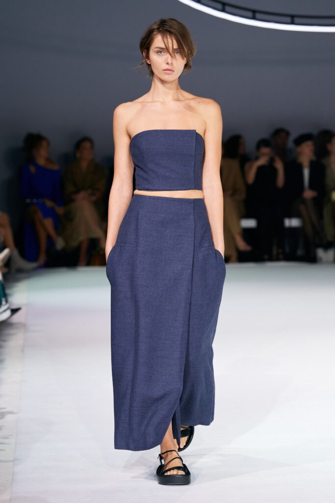 A fitted blue cotton sleeveless crop-top paired with a matching maxi-dress featuring a straight-leg silhouette.