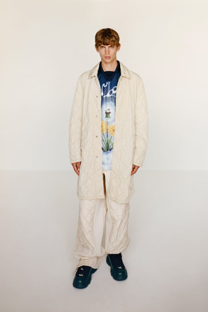 A relaxed beige quilted coat paired with matching pants, featuring a collared design.