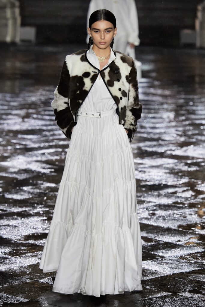 black and white fur jacket with white tiered dress