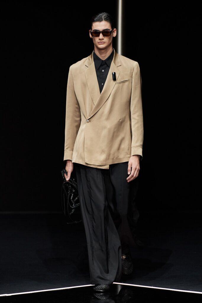 beige tailored blazer with black pants