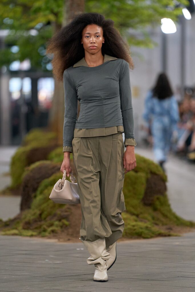 gray fitted top with beige pants