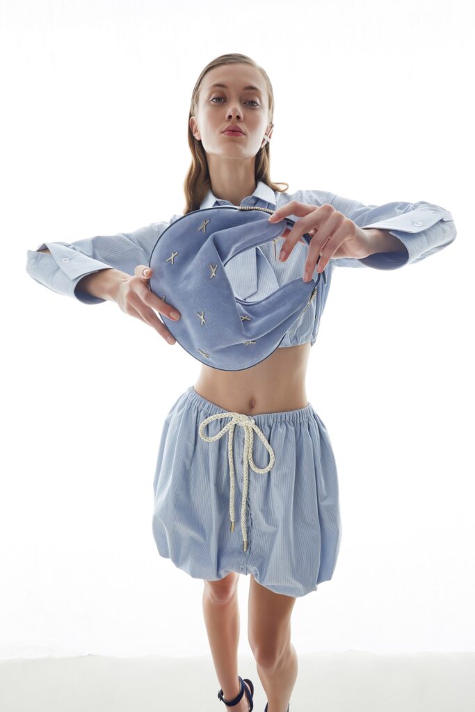 blue fitted top and relaxed skirt