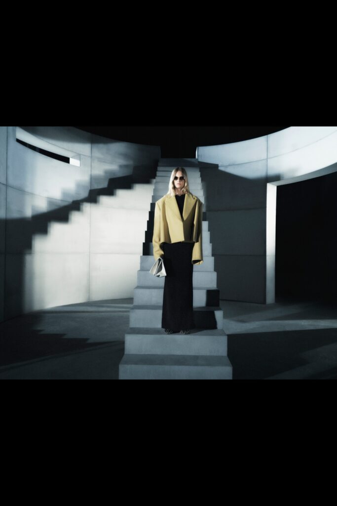 yellow oversized coat black pencil skirt