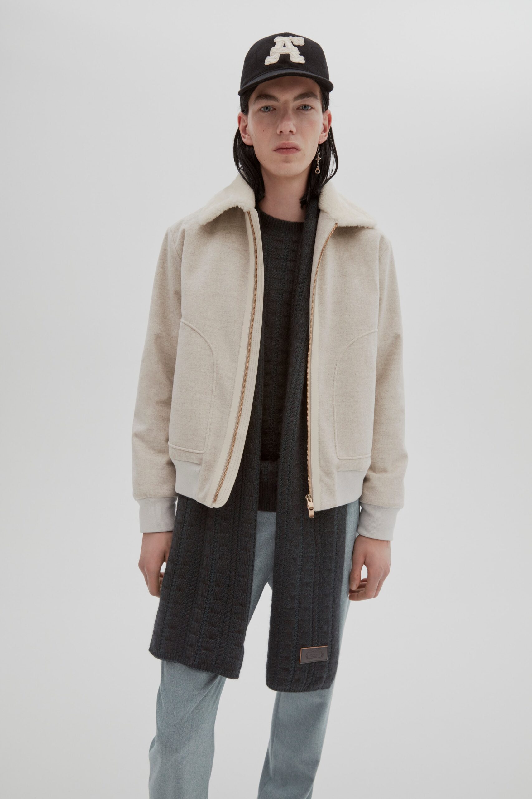 beige jacket gray sweater denim pants