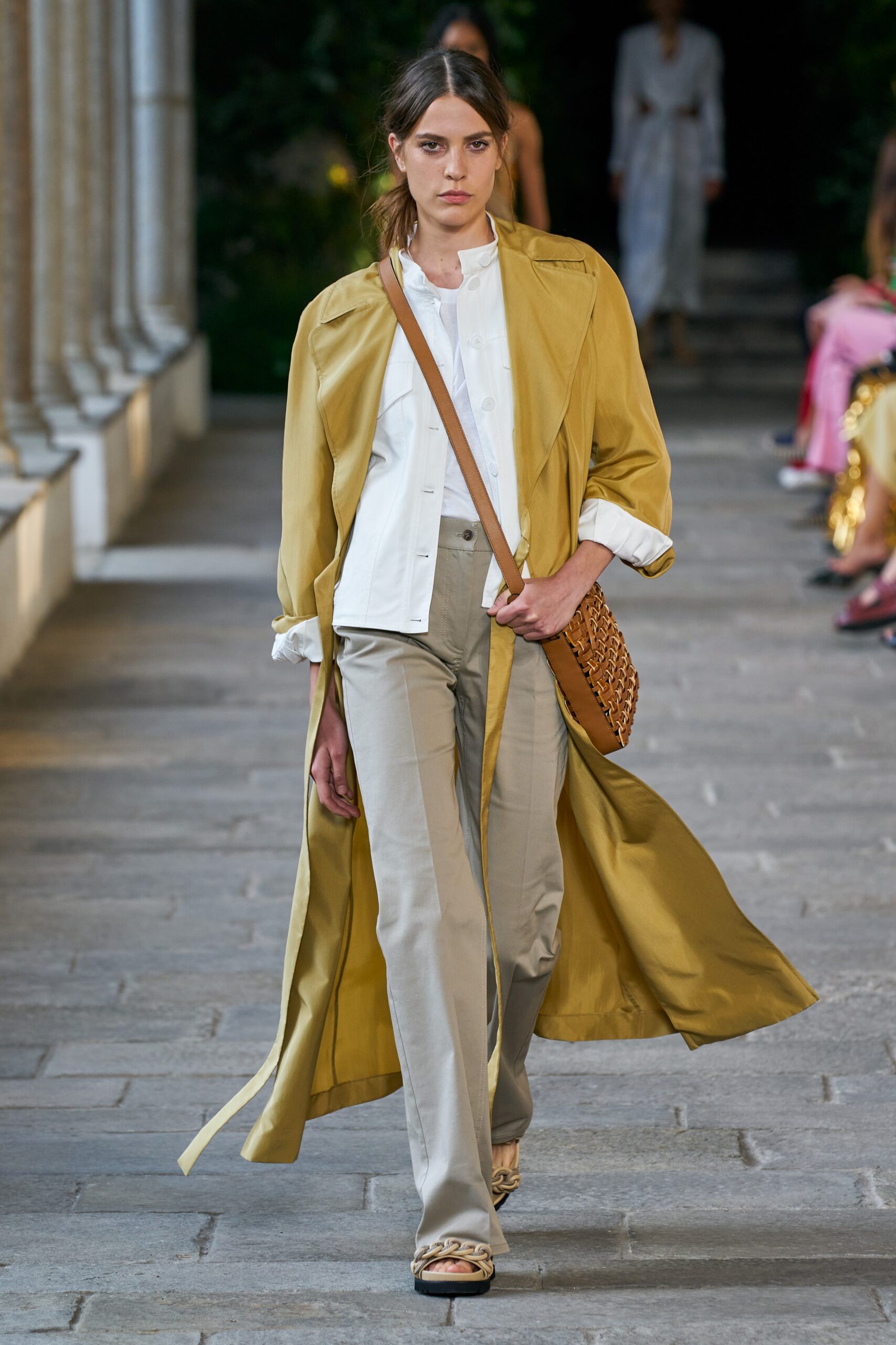 yellow coat with beige pants