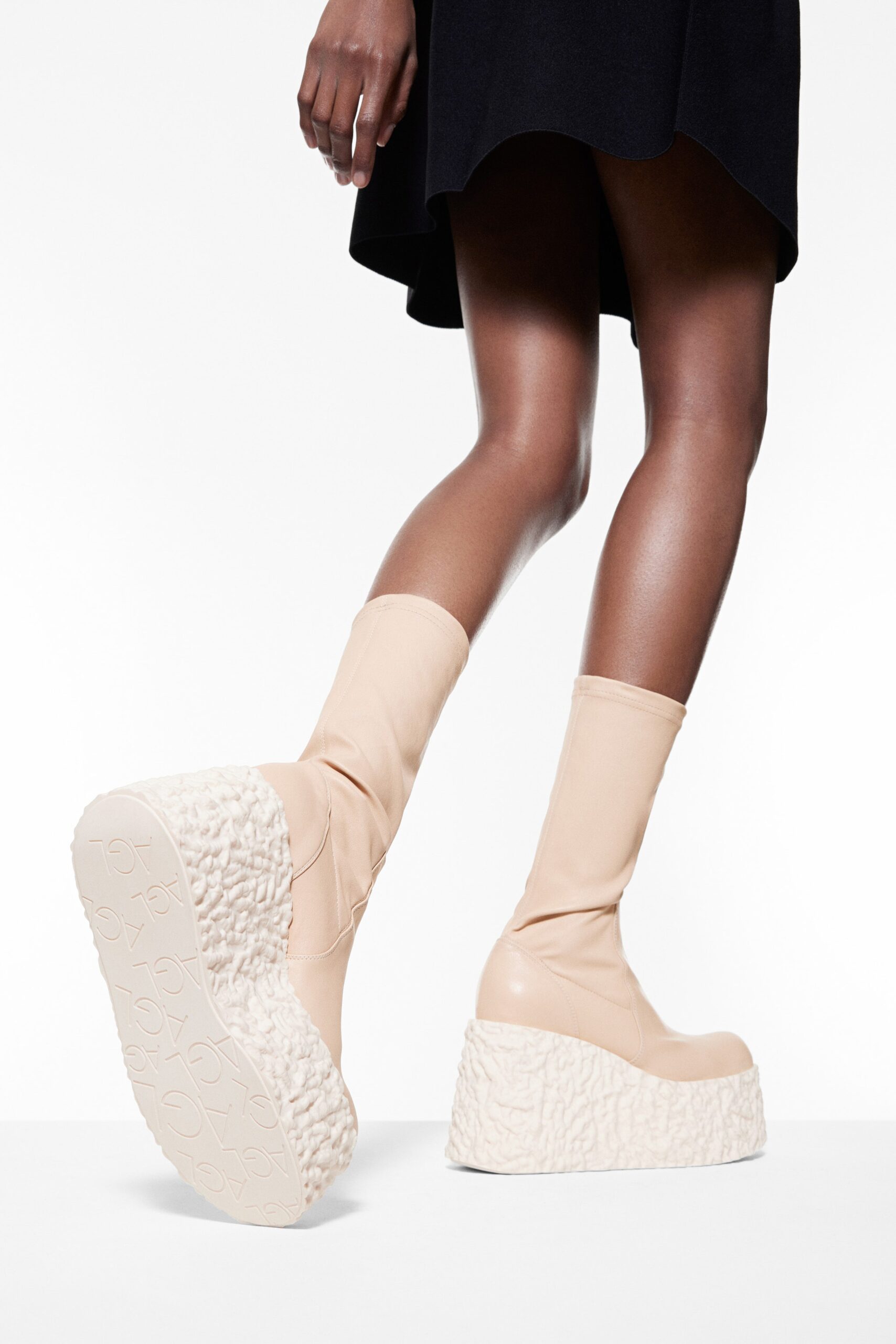 black mini dress and beige platform boots