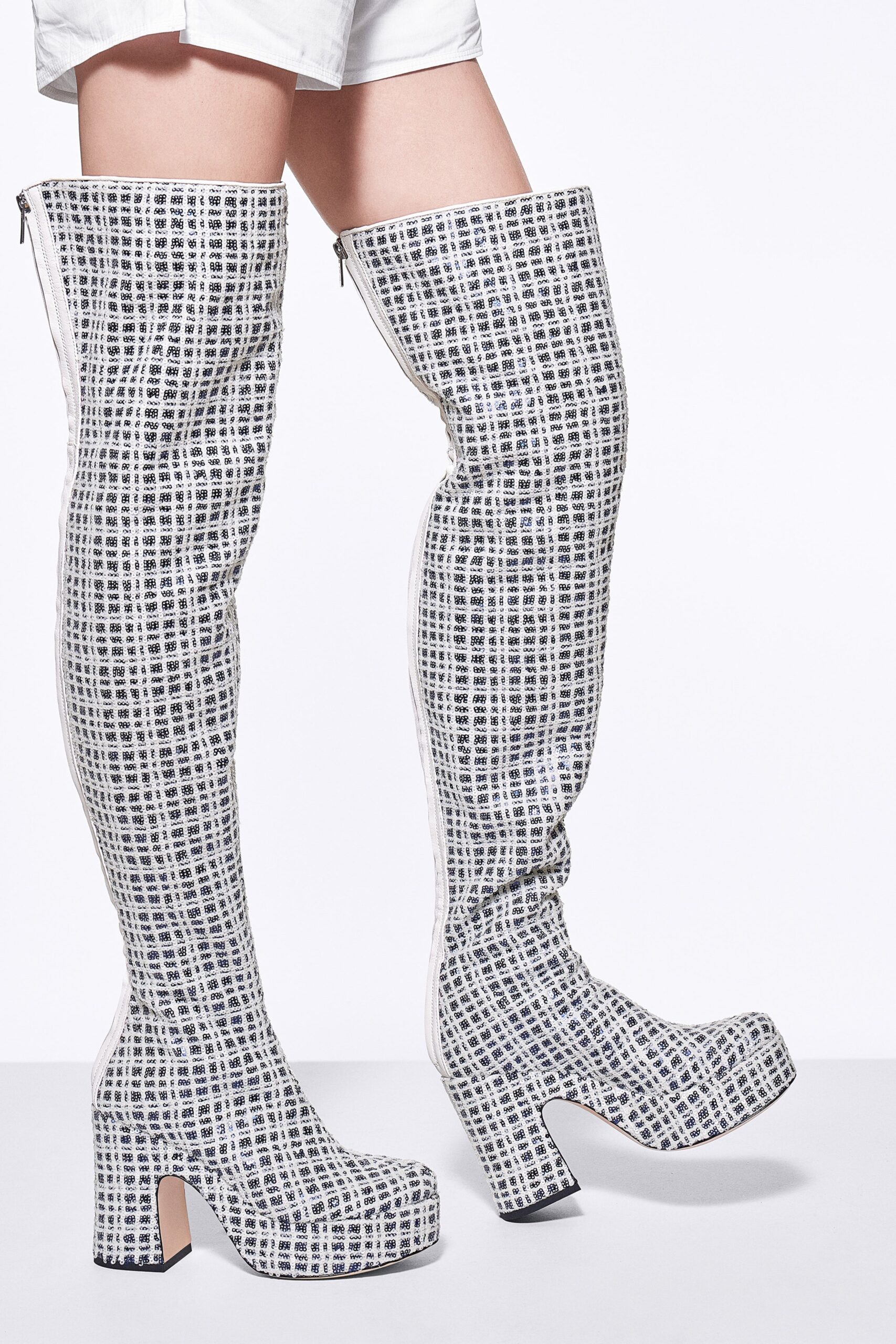 white and black patterned boots