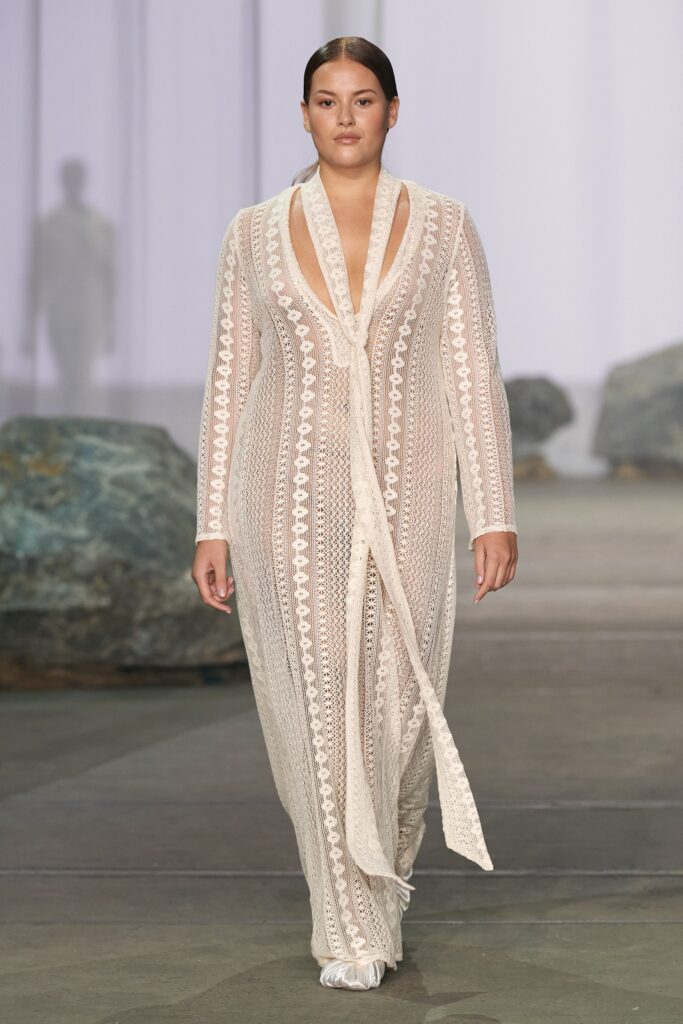 A relaxed beige lace sleeveless dress with a V-neckline and tiered design.