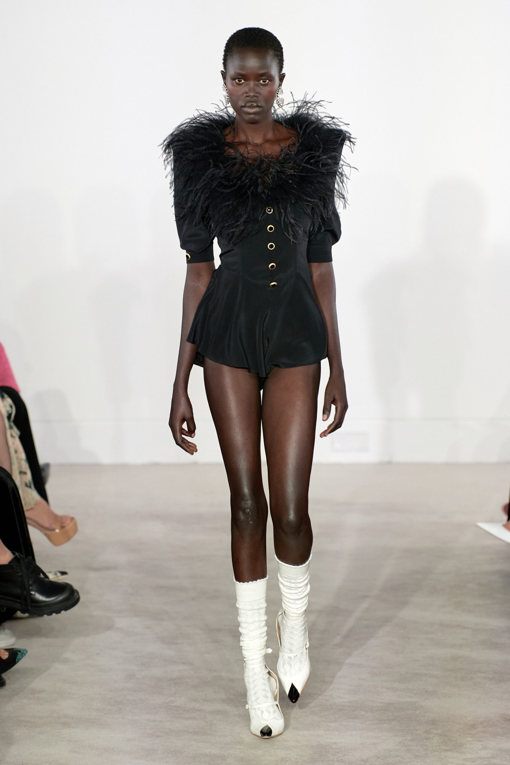 black fitted romper with white boots