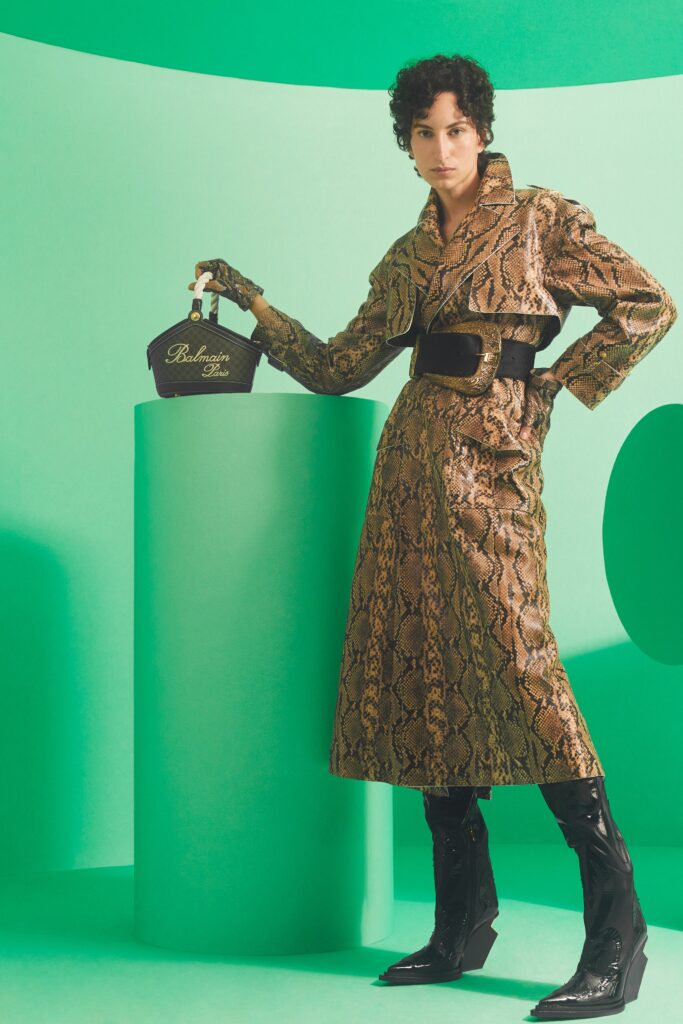 A fitted brown leather coat with a collared neckline and printed texture.