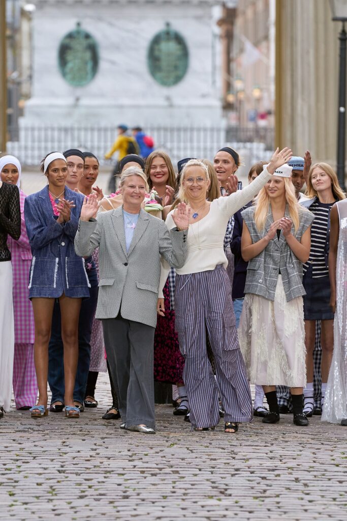 gray tailored blazer with striped pants