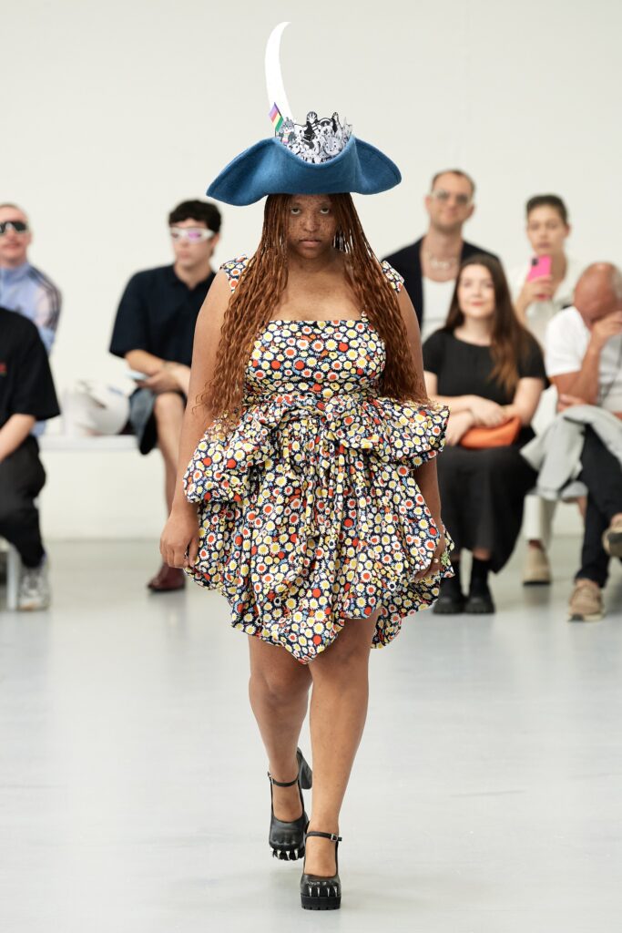 A relaxed multicolor sleeveless dress with a collared design and tiered silhouette.