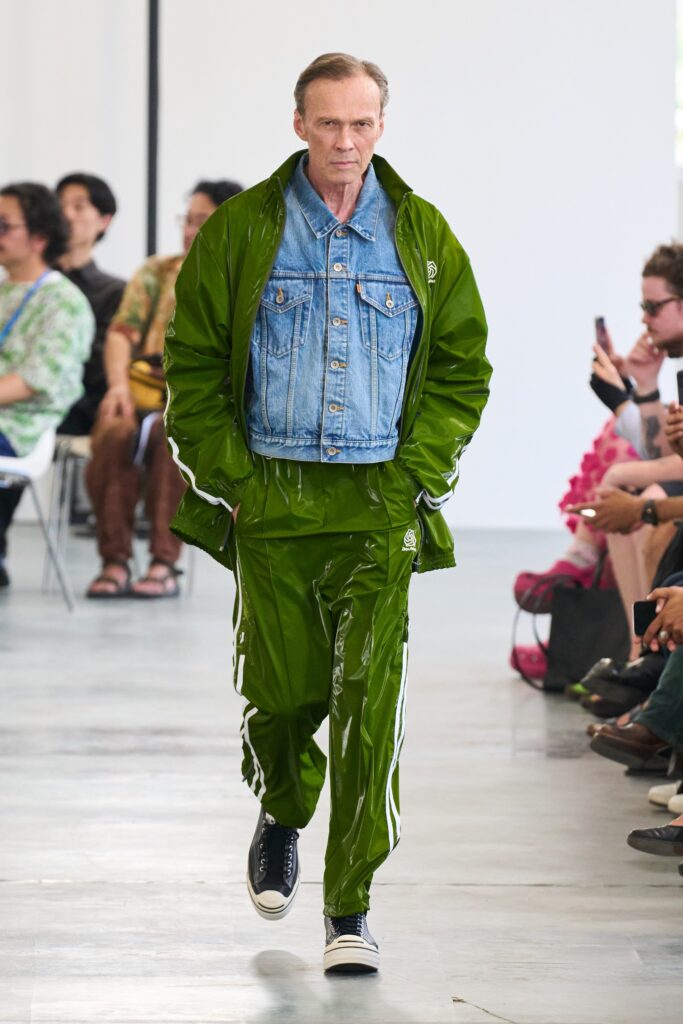 A relaxed green leather jacket with long sleeves and matching pants featuring a zippered detail.