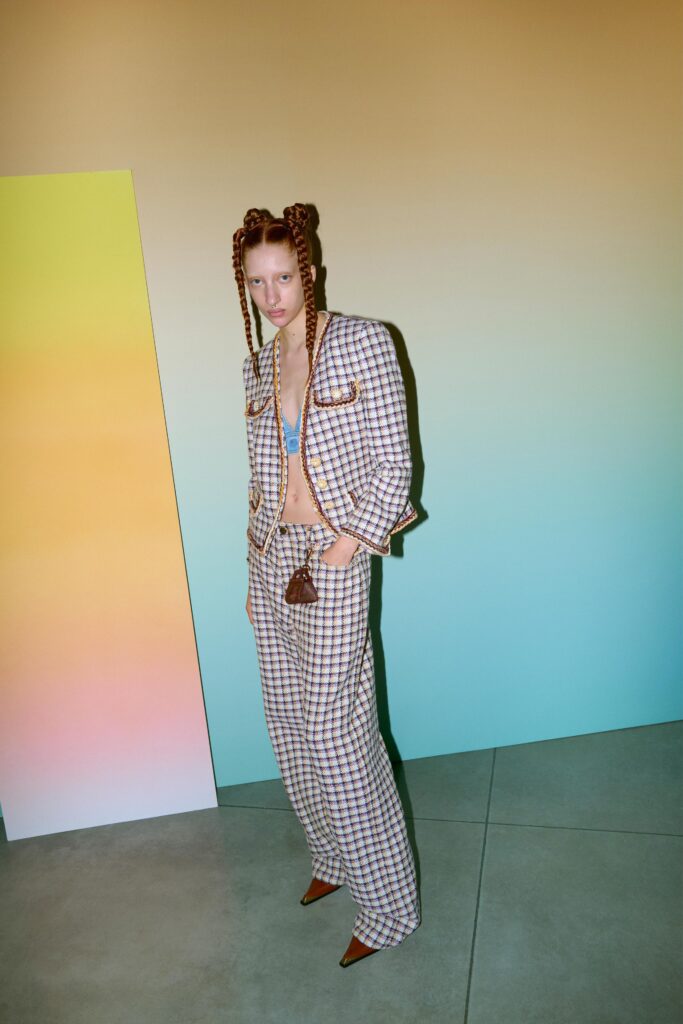 A relaxed beige checked blazer paired with matching pants, featuring a collared design.