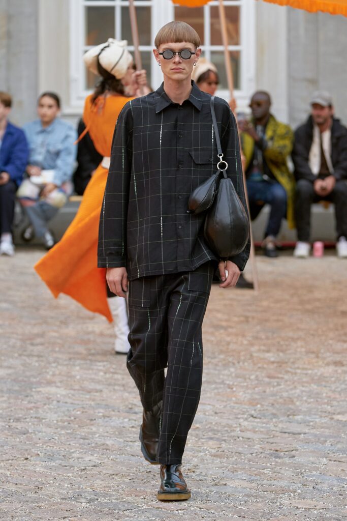 A relaxed black checked shirt paired with matching relaxed pants for a contemporary look.