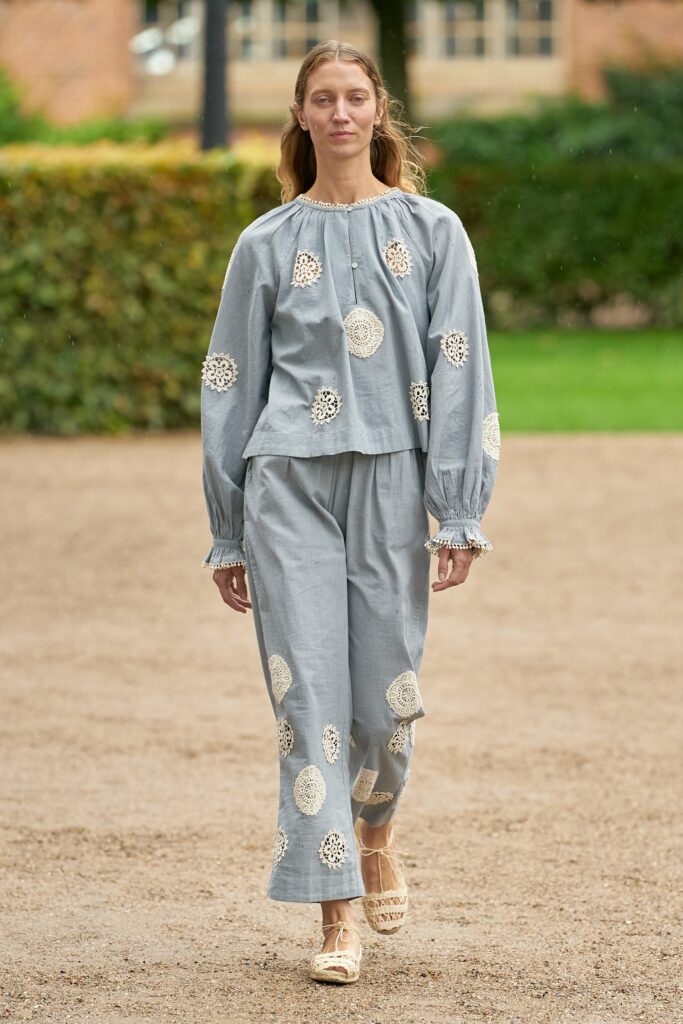 A relaxed gray cotton top with long sleeves and embroidered details, paired with matching pants.
