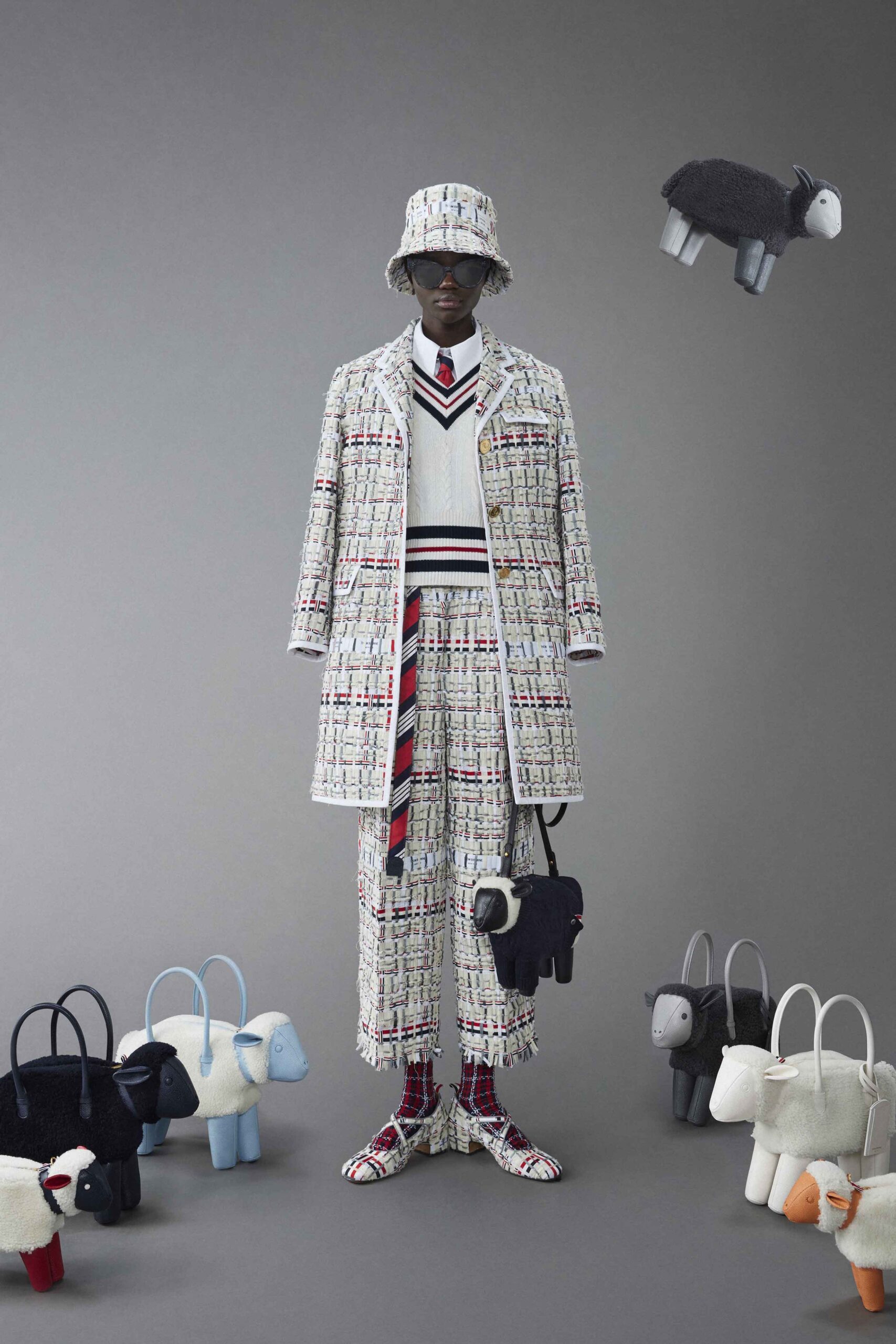 A relaxed-fit multicolor tweed coat with long sleeves and checked design, paired with matching pants.