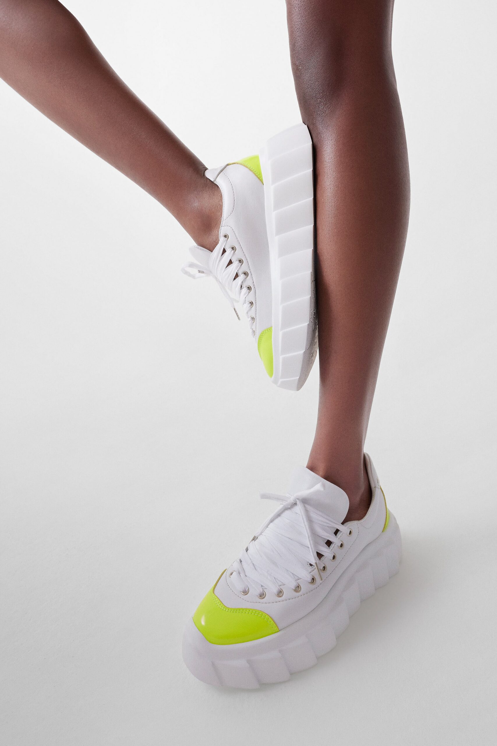white and yellow fitted shoes