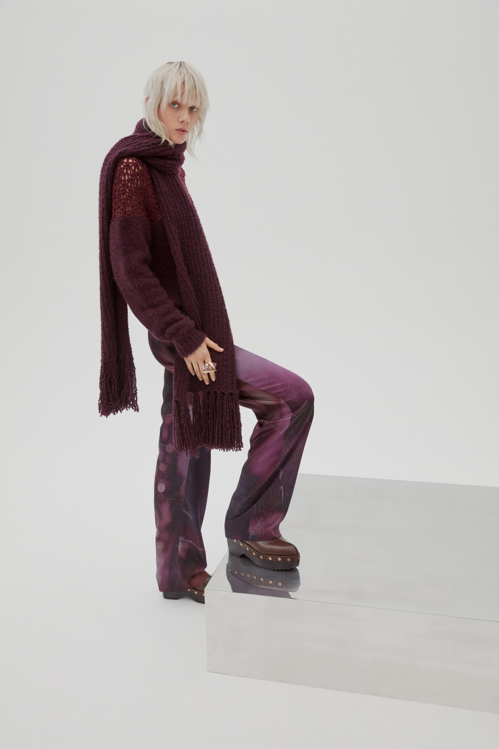 purple knit sweater and flared pants