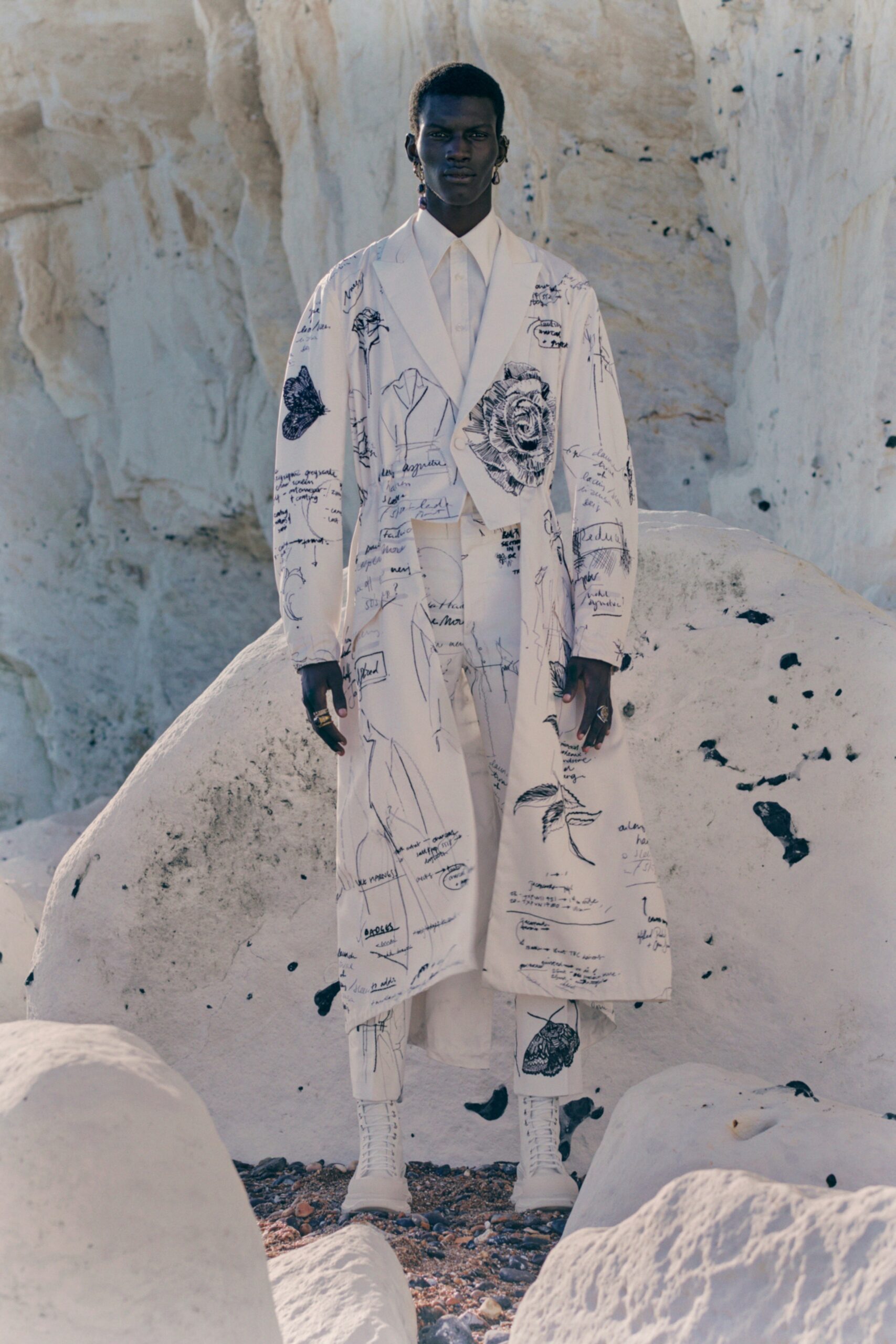 white printed coat with tailored pants