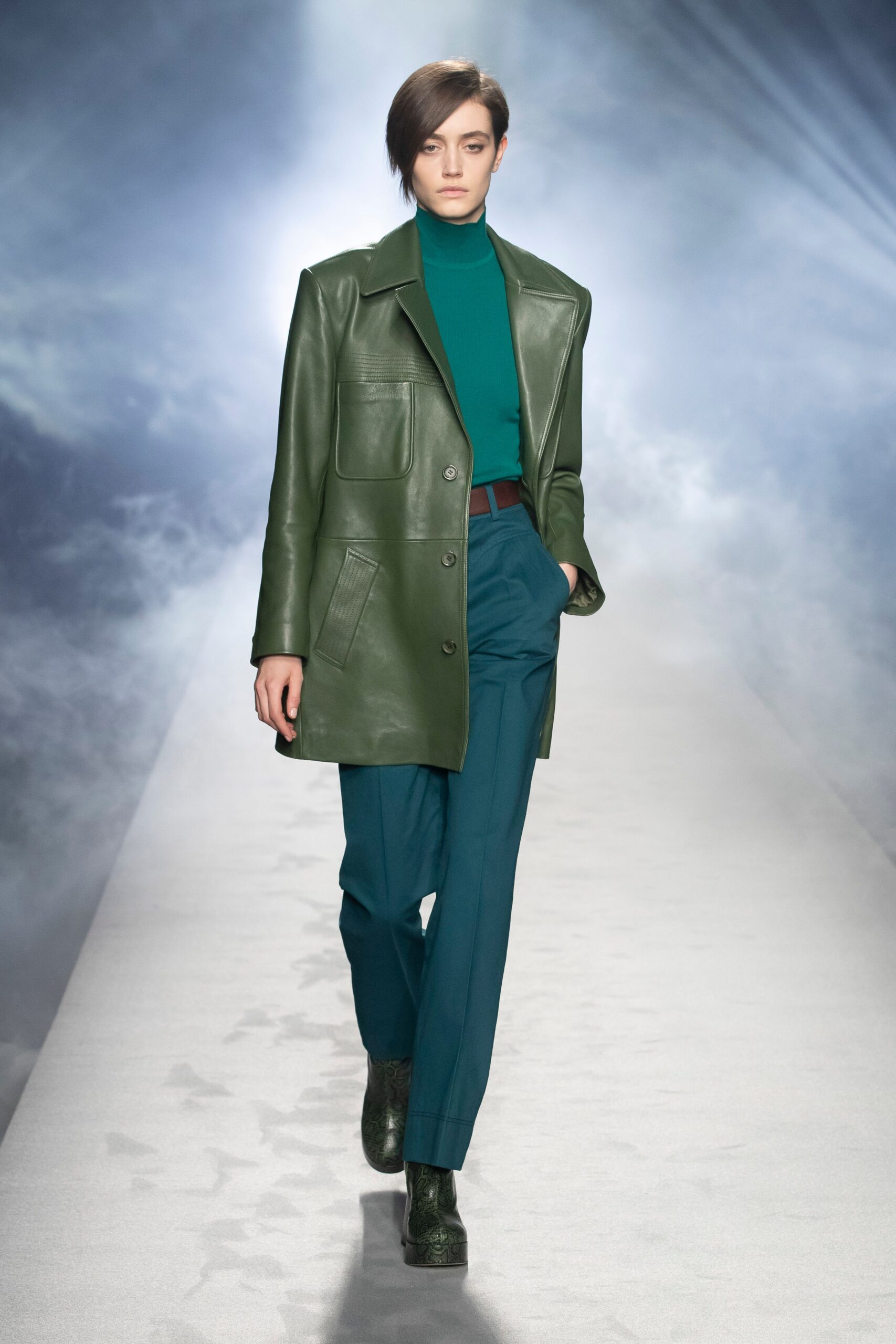 green leather coat with blue top