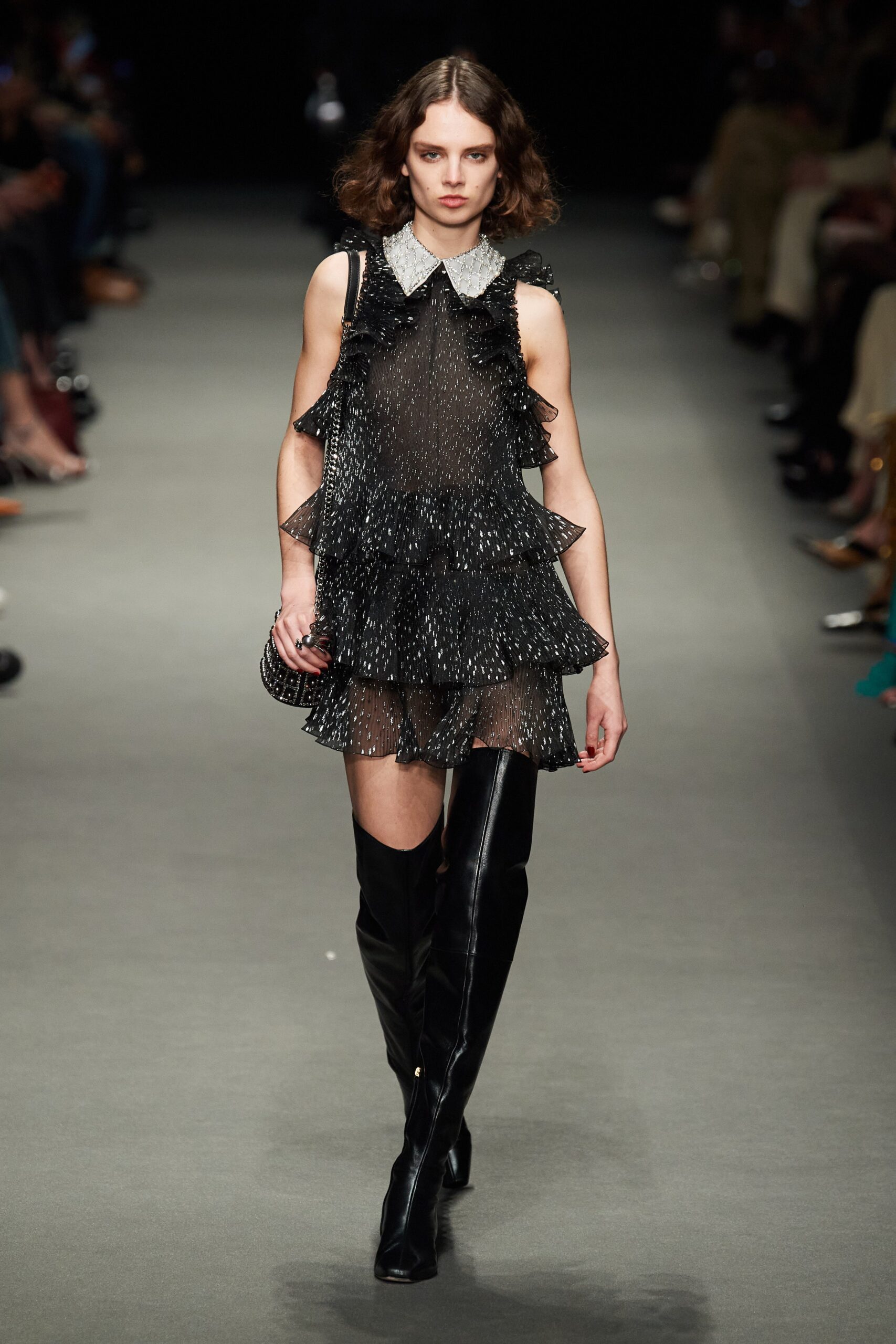 black ruffled mini dress with boots