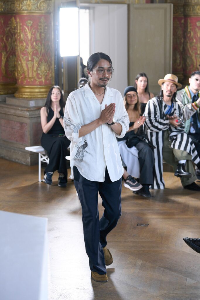 white embroidered shirt with blue pants