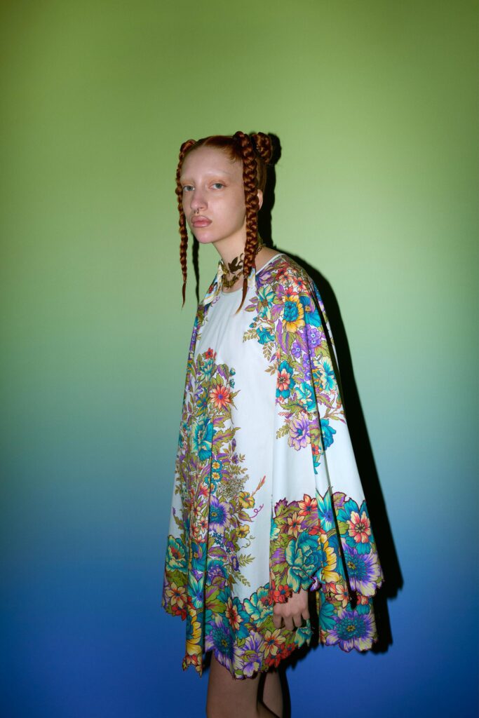 A relaxed multicolor floral dress with a flared silhouette and sleeveless design.