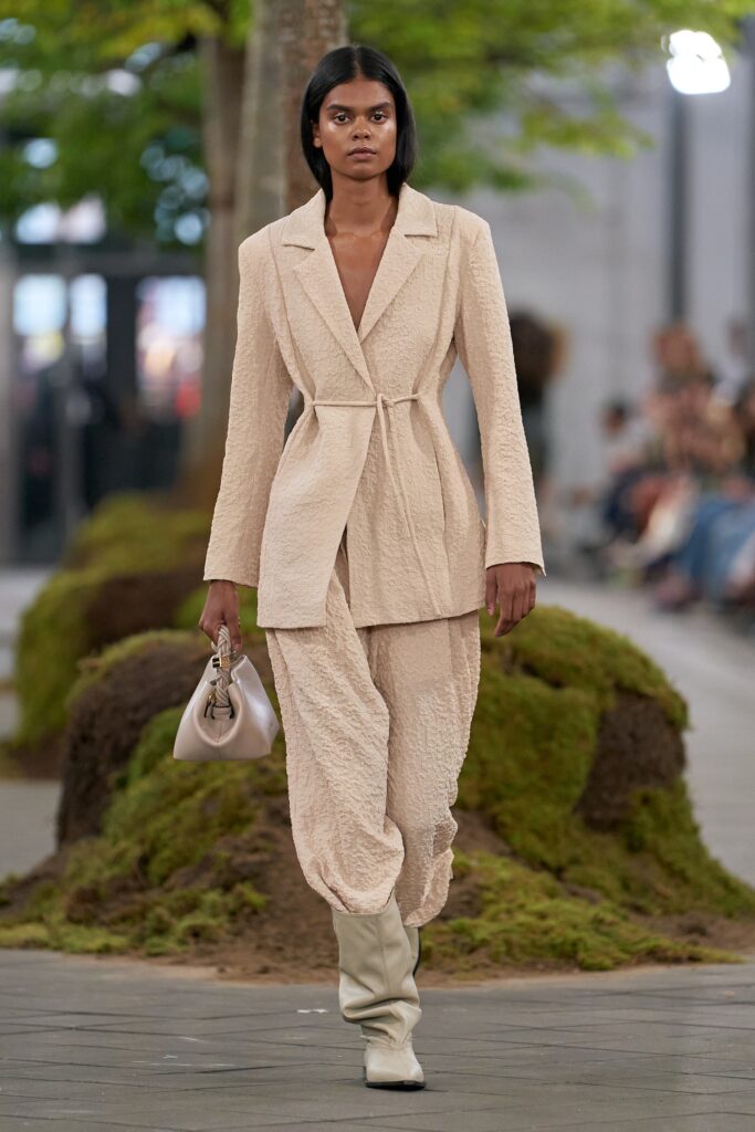 beige fitted suit with relaxed pants