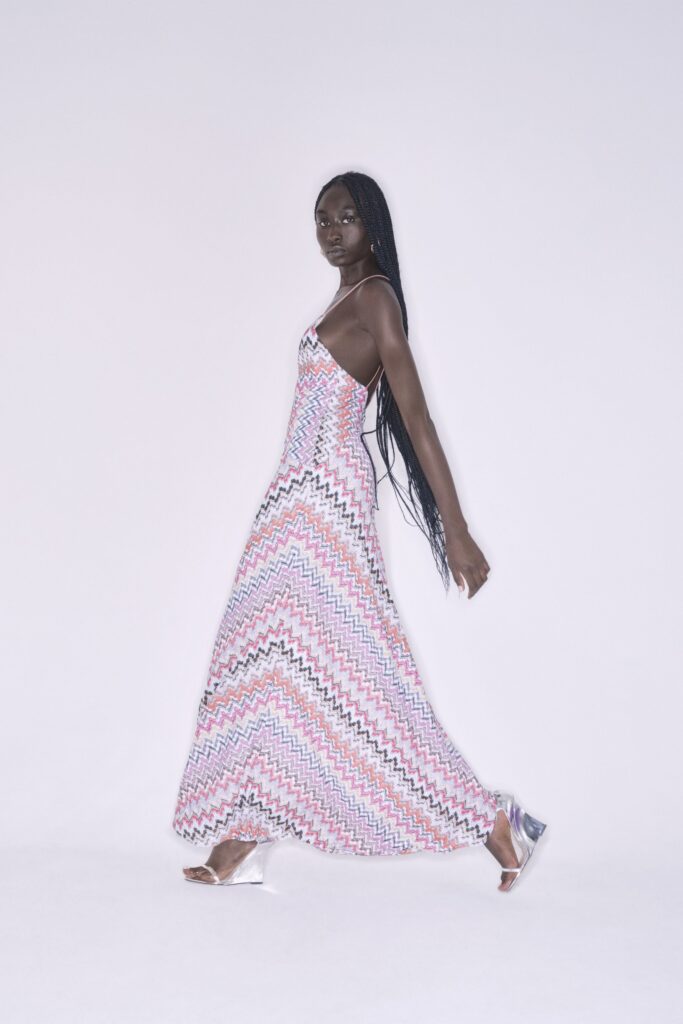 A fitted multicolor silk sleeveless dress with a V-neckline and tiered design.