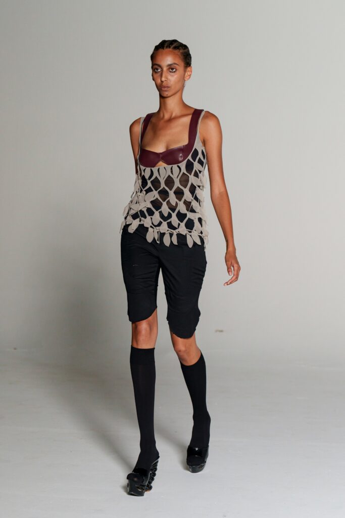 beige layered top with black shorts