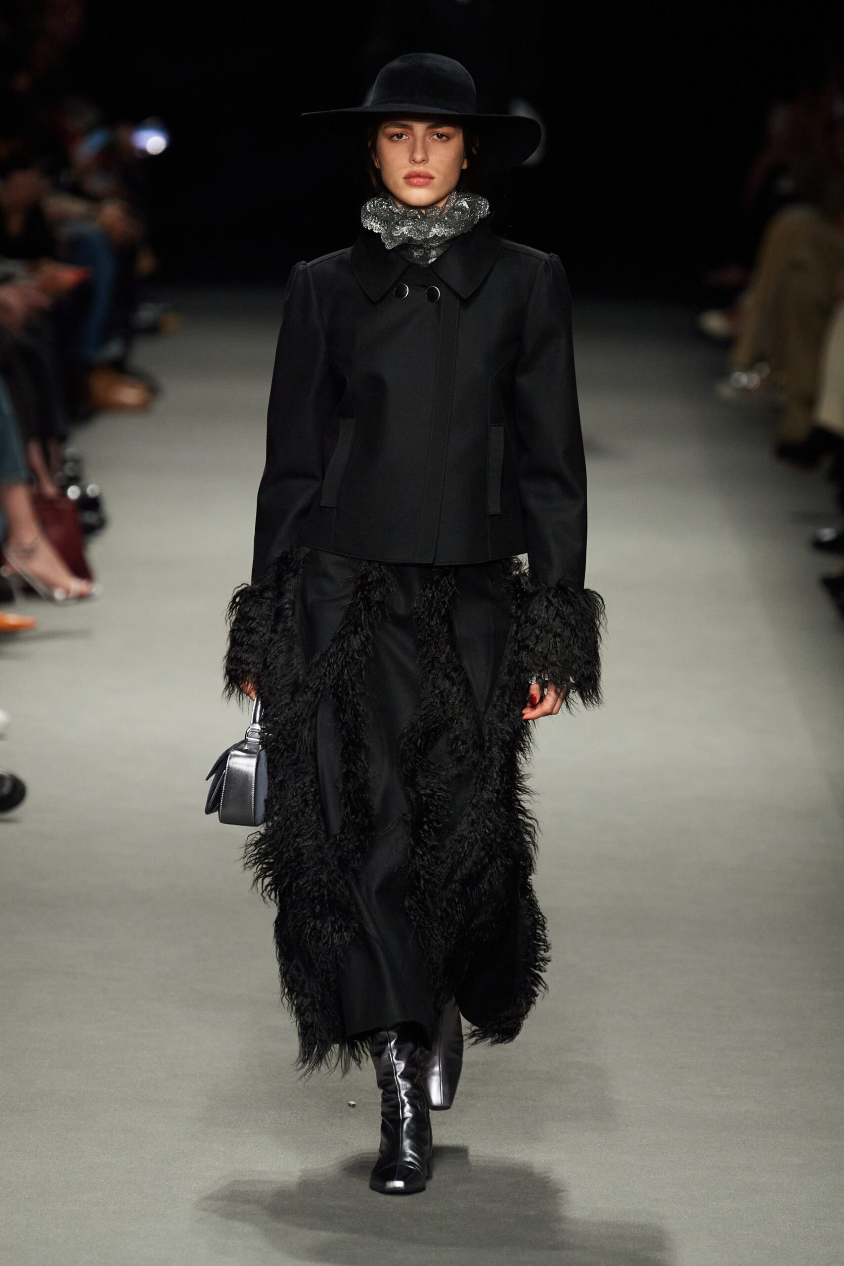 black wool coat with fringed skirt