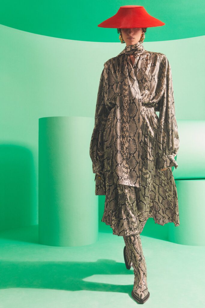 A relaxed multicolor silk dress with long sleeves and a collared neckline featuring an asymmetric design.