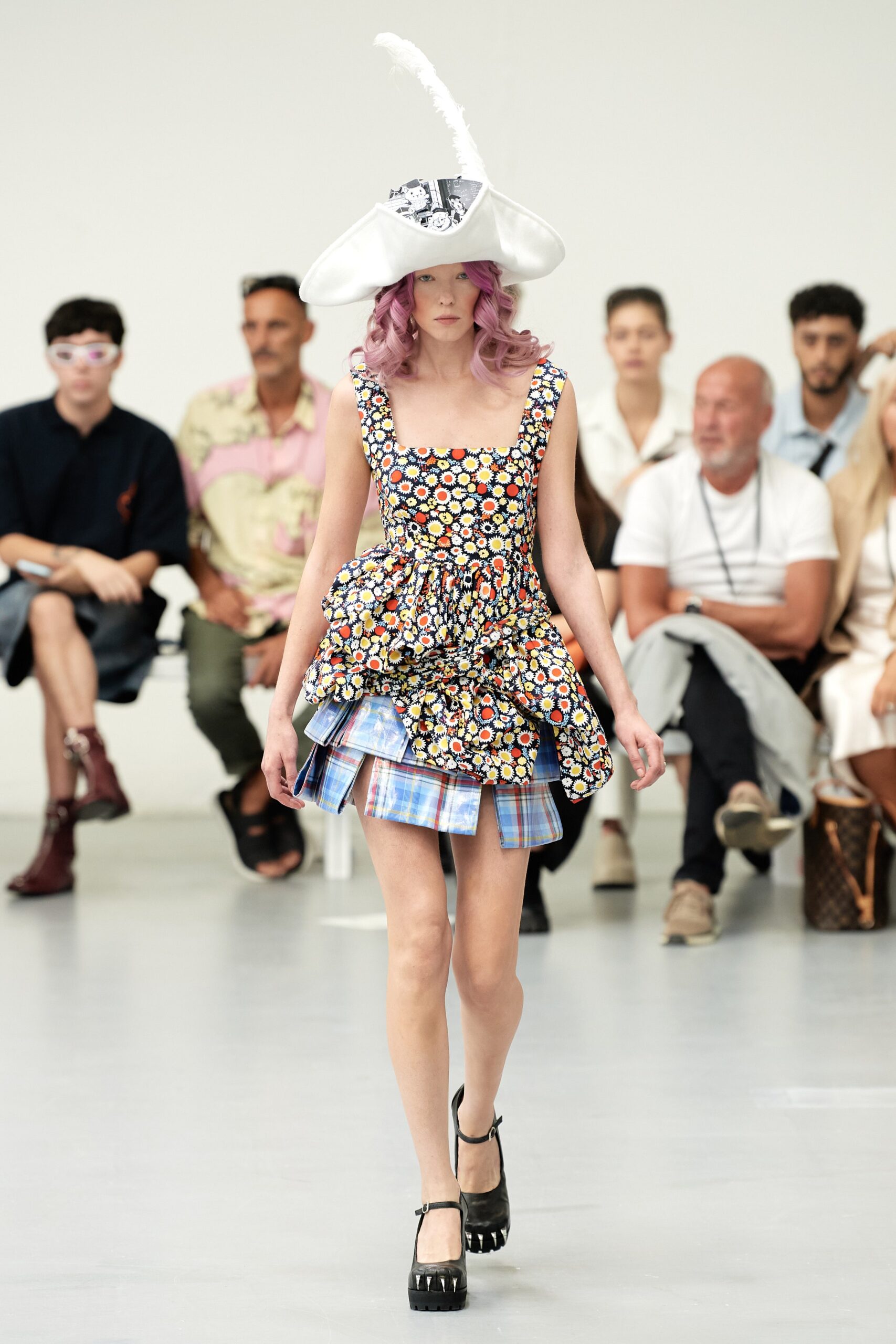 A fitted multicolor sleeveless dress with a V-neckline and flared silhouette.
