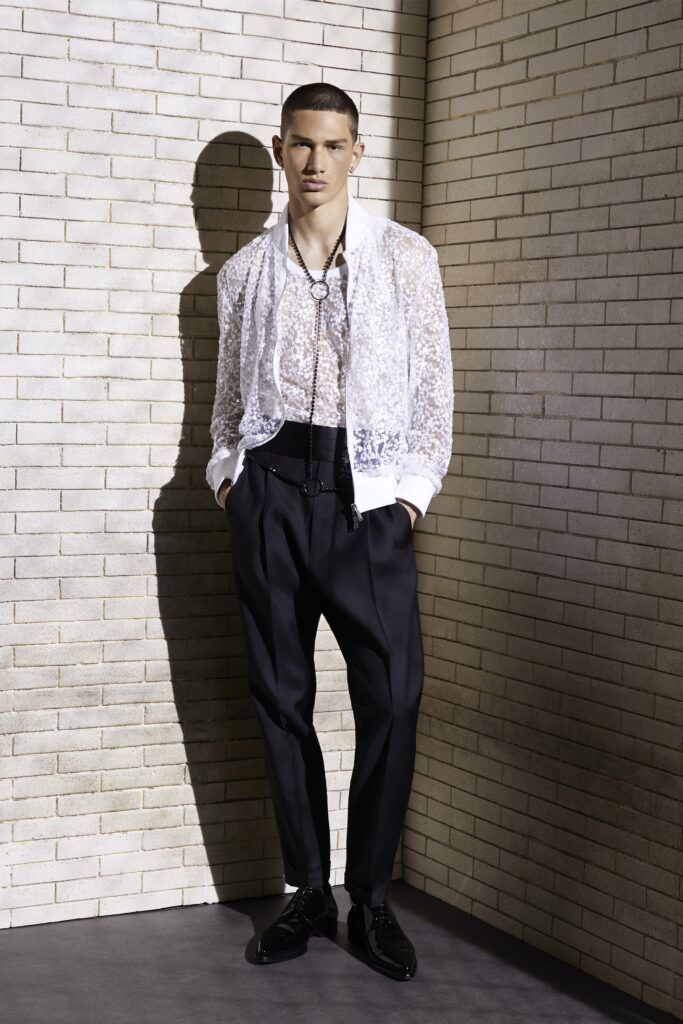 white lace shirt and black tailored pants