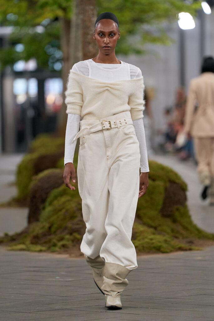 white wool sleeveless sweater and beige wide-leg pants