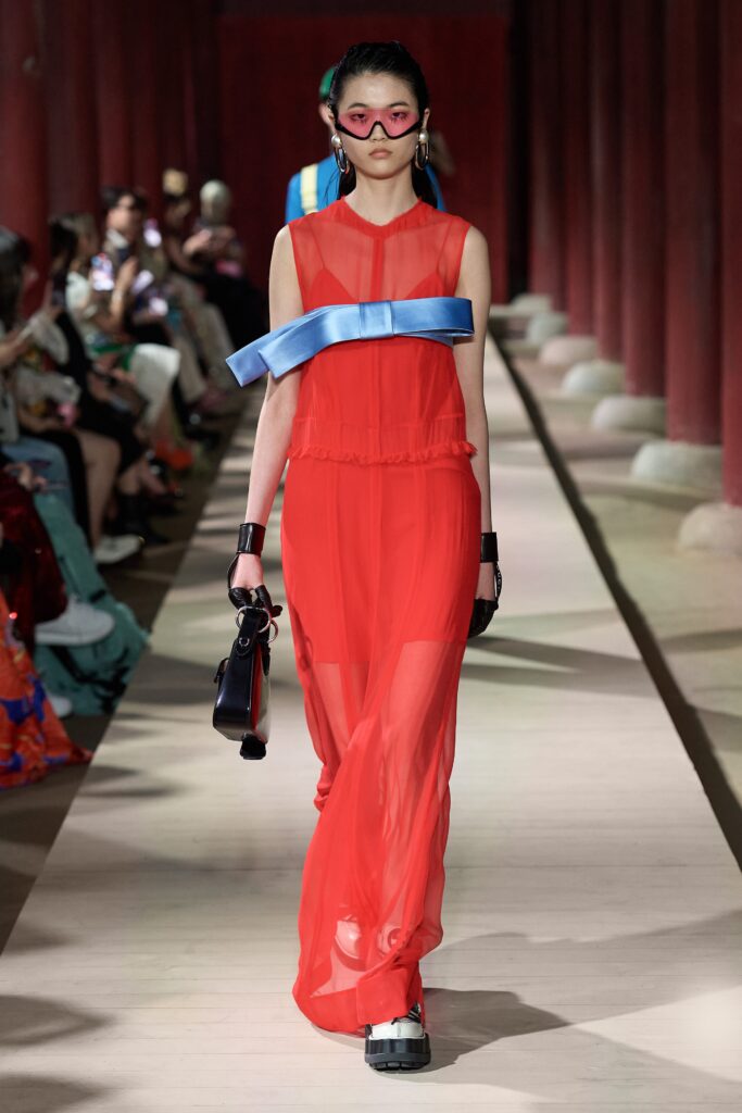 red sheer maxi dress with blue belt
