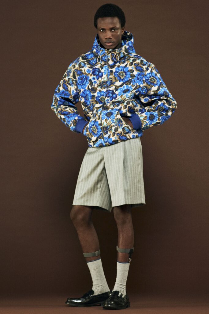 blue printed jacket with gray shorts