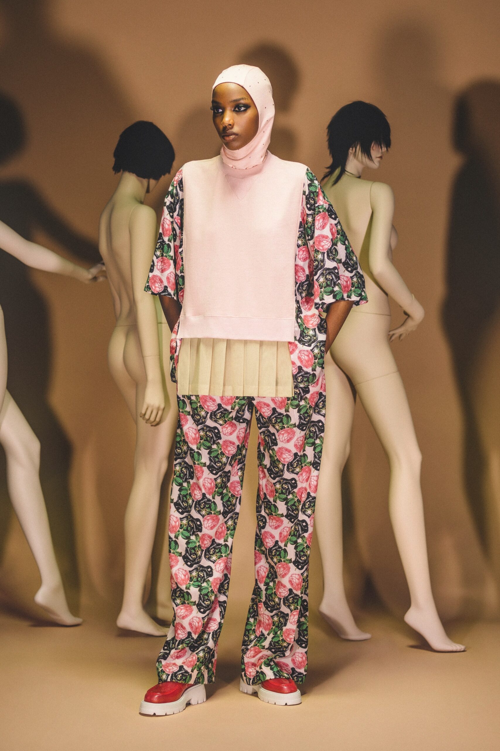 A relaxed fit pink multicolor printed top with short sleeves paired with matching printed pants.