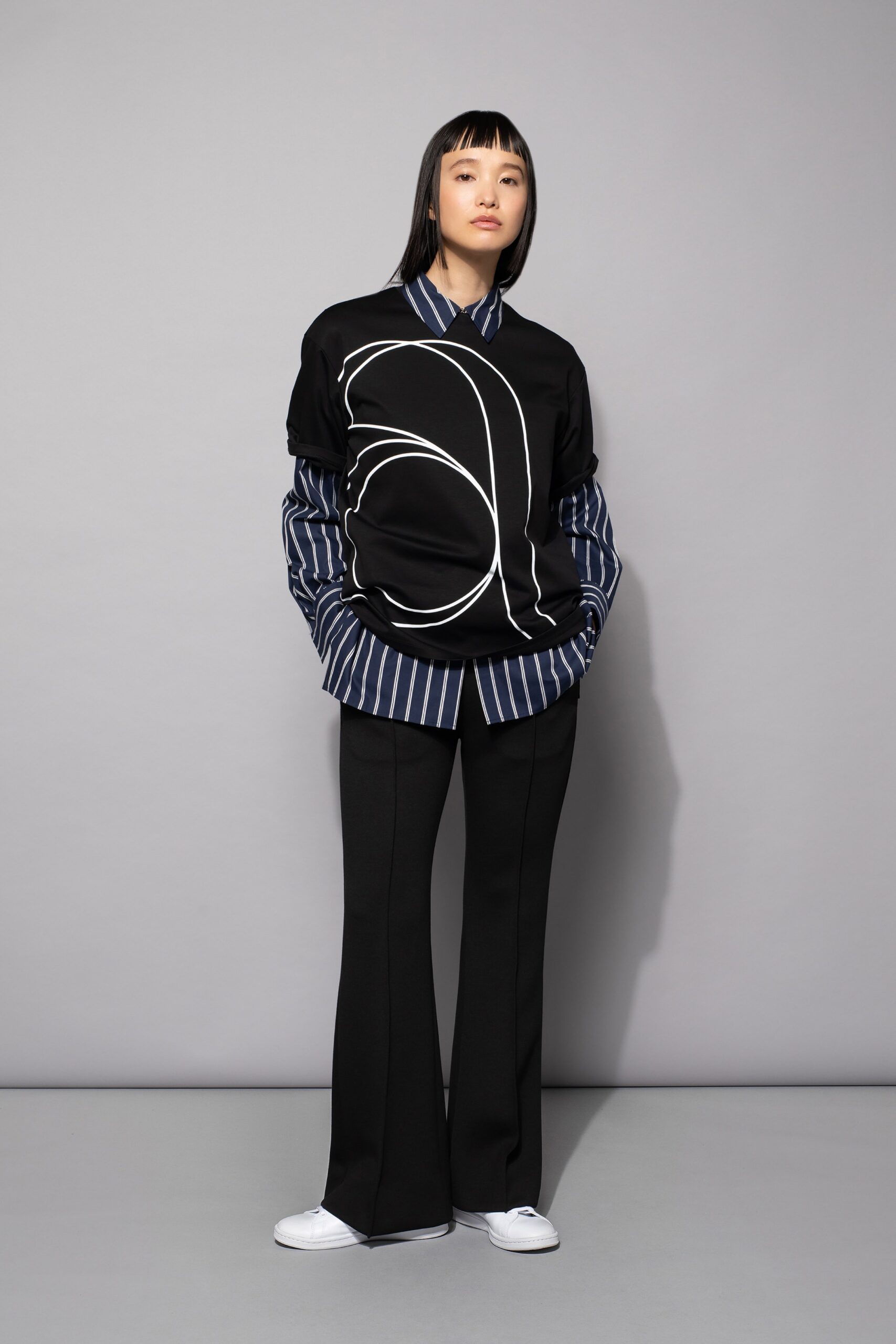 black and blue relaxed top with flared pants