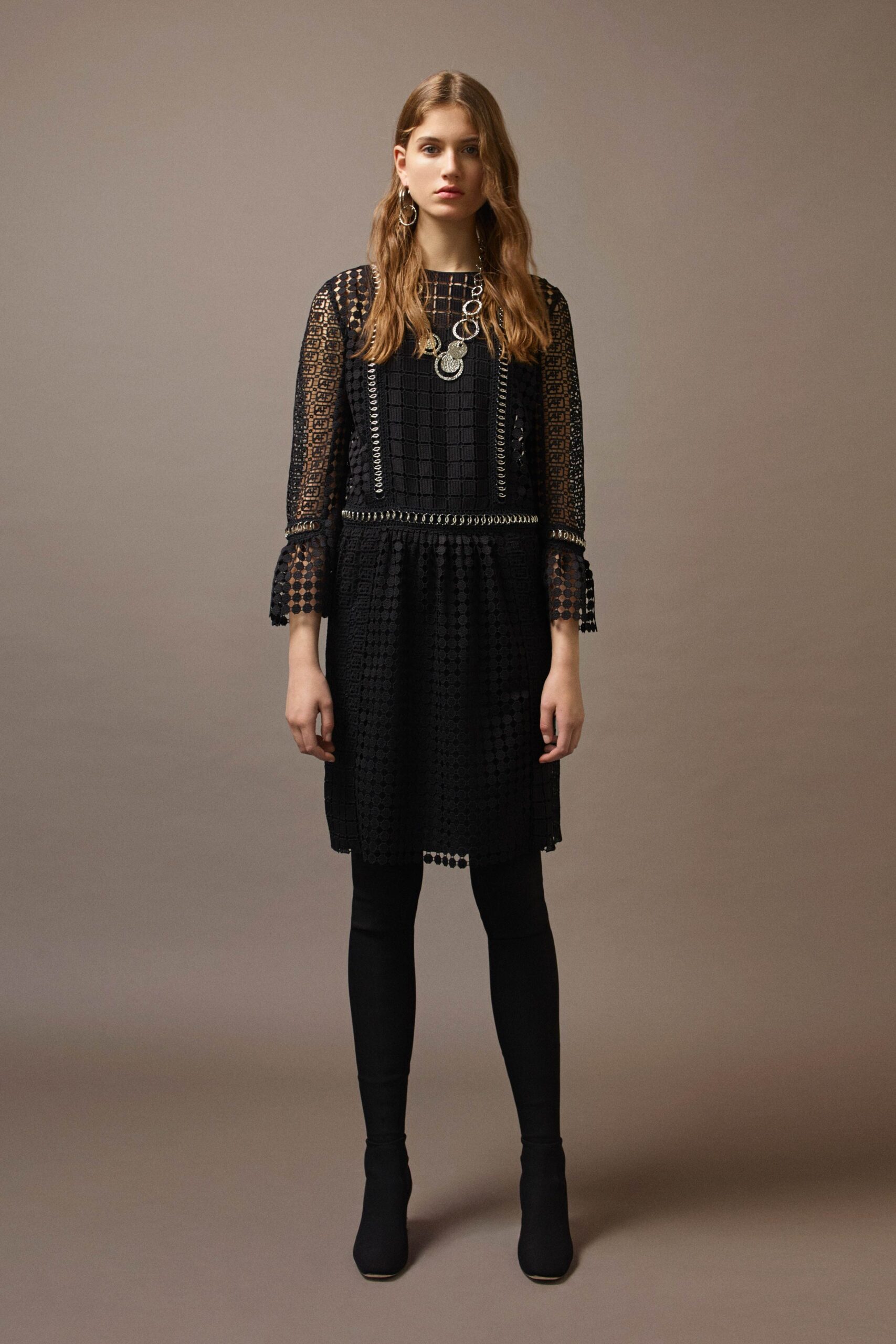 black fitted mini dress with leggings