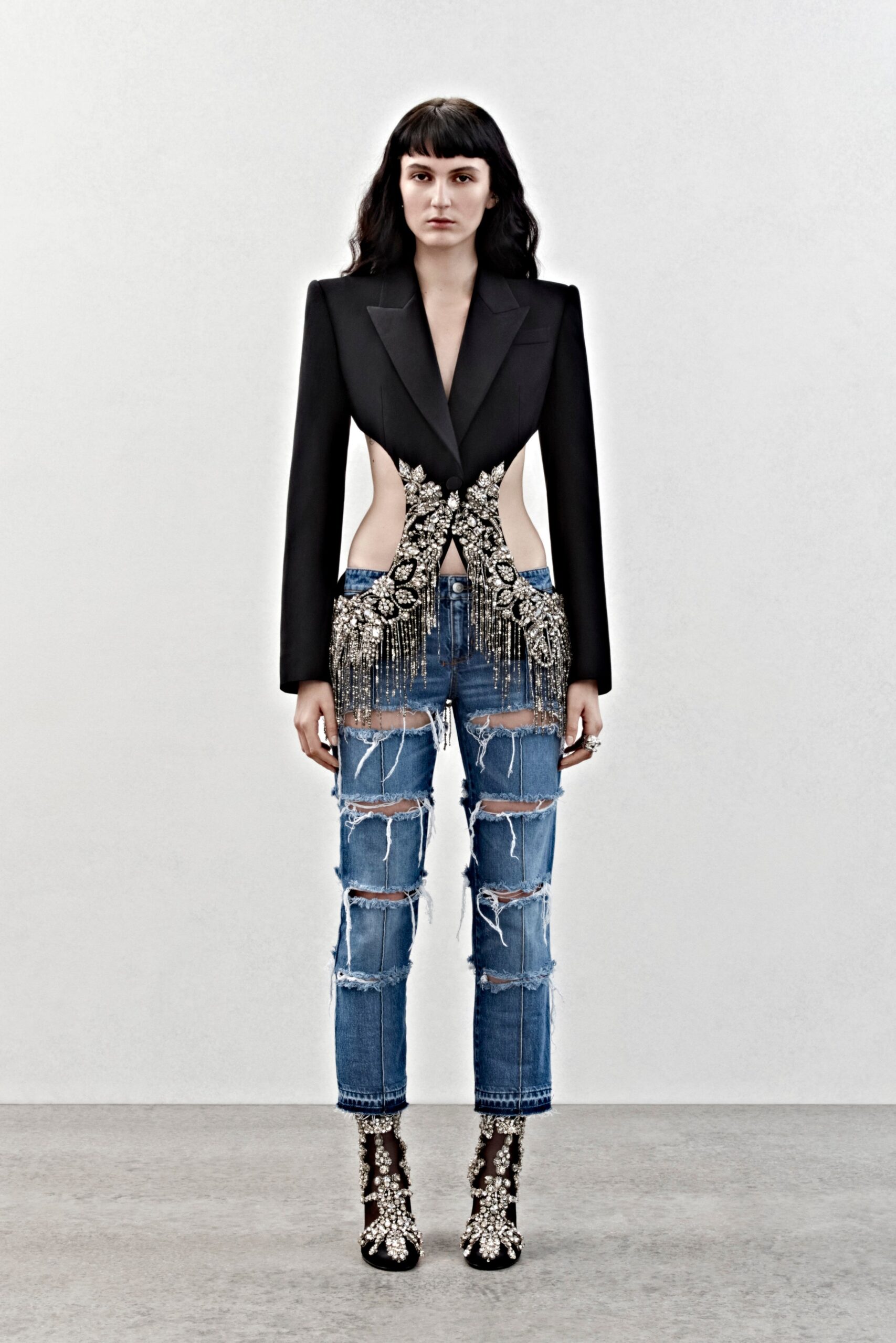 black beaded blazer with distressed jeans