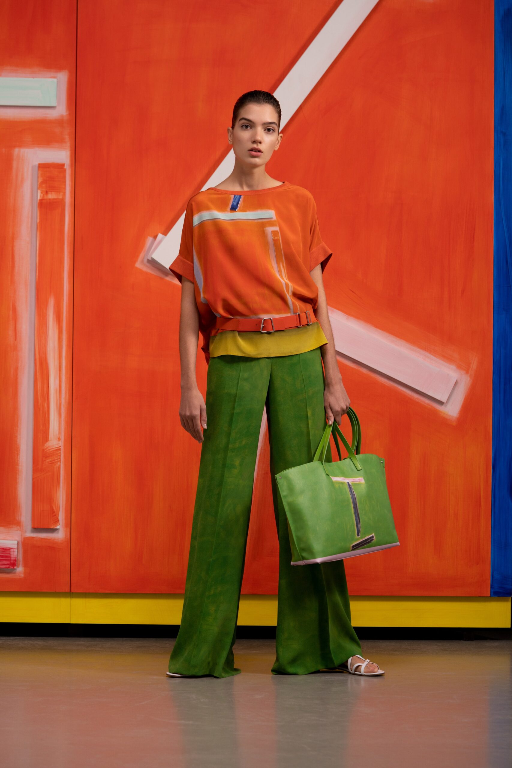 color-blocked orange top with green pants
