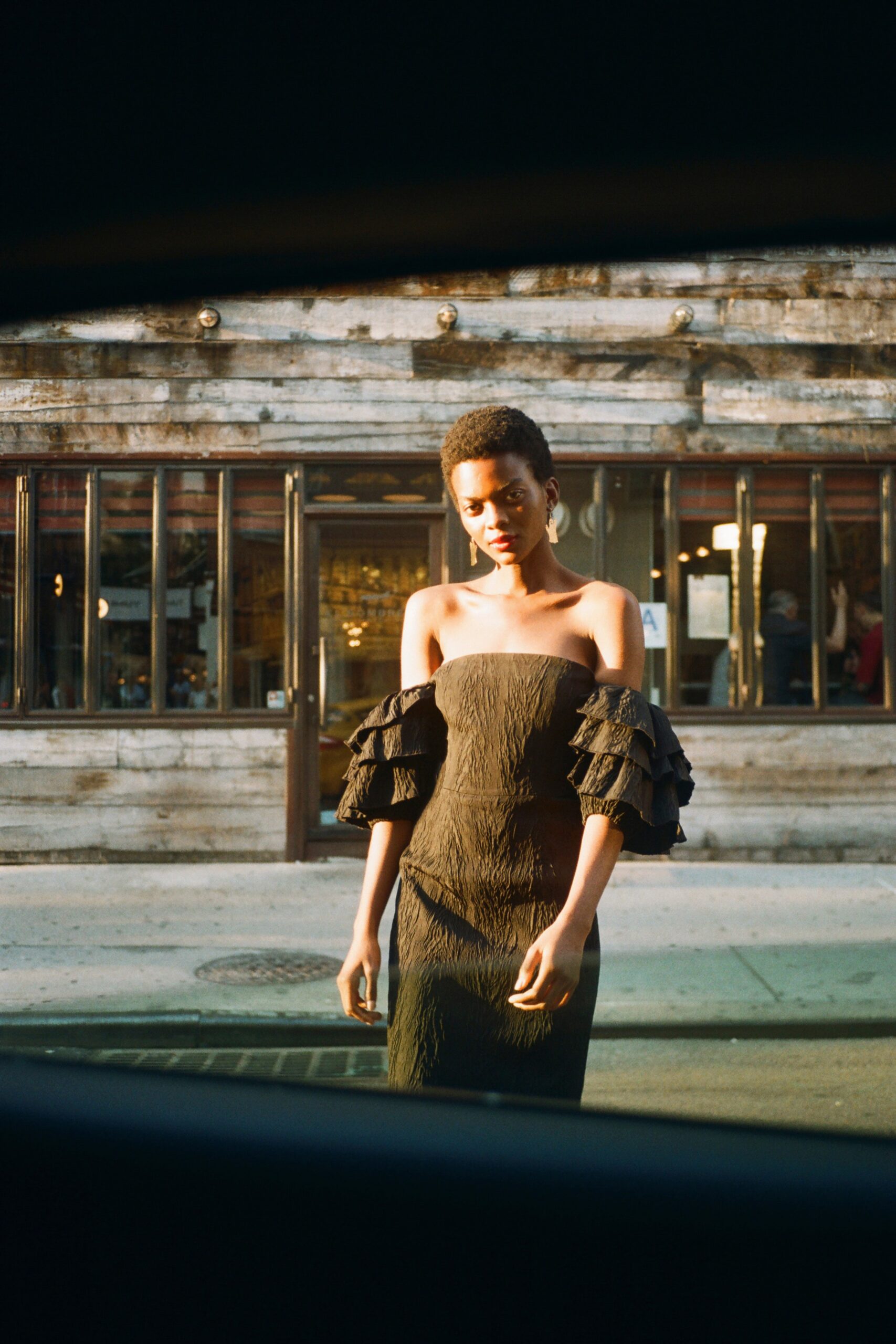 black off-shoulder ruffled dress