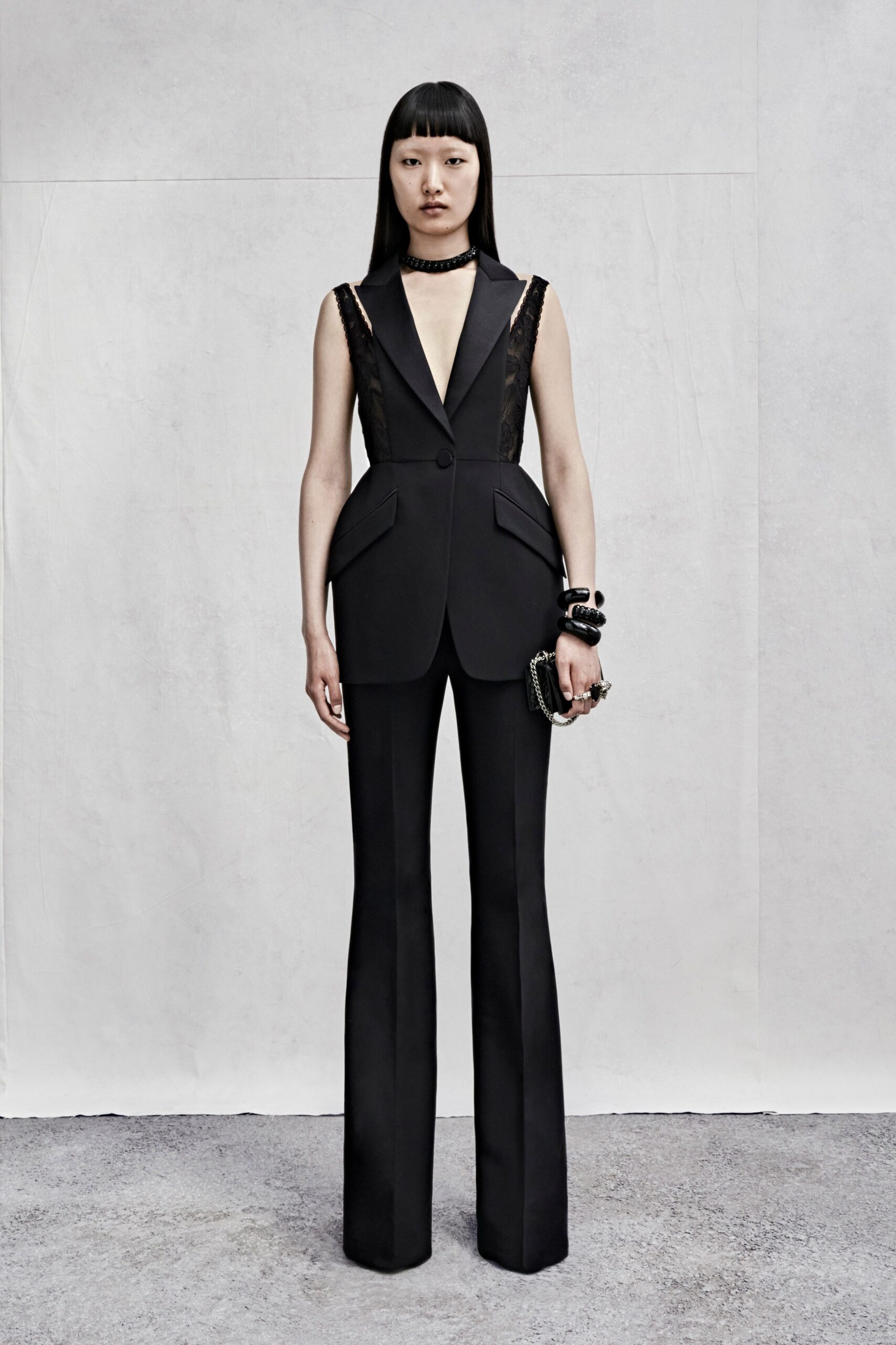 black silk sleeveless v-neck fitted structured buttoned suit