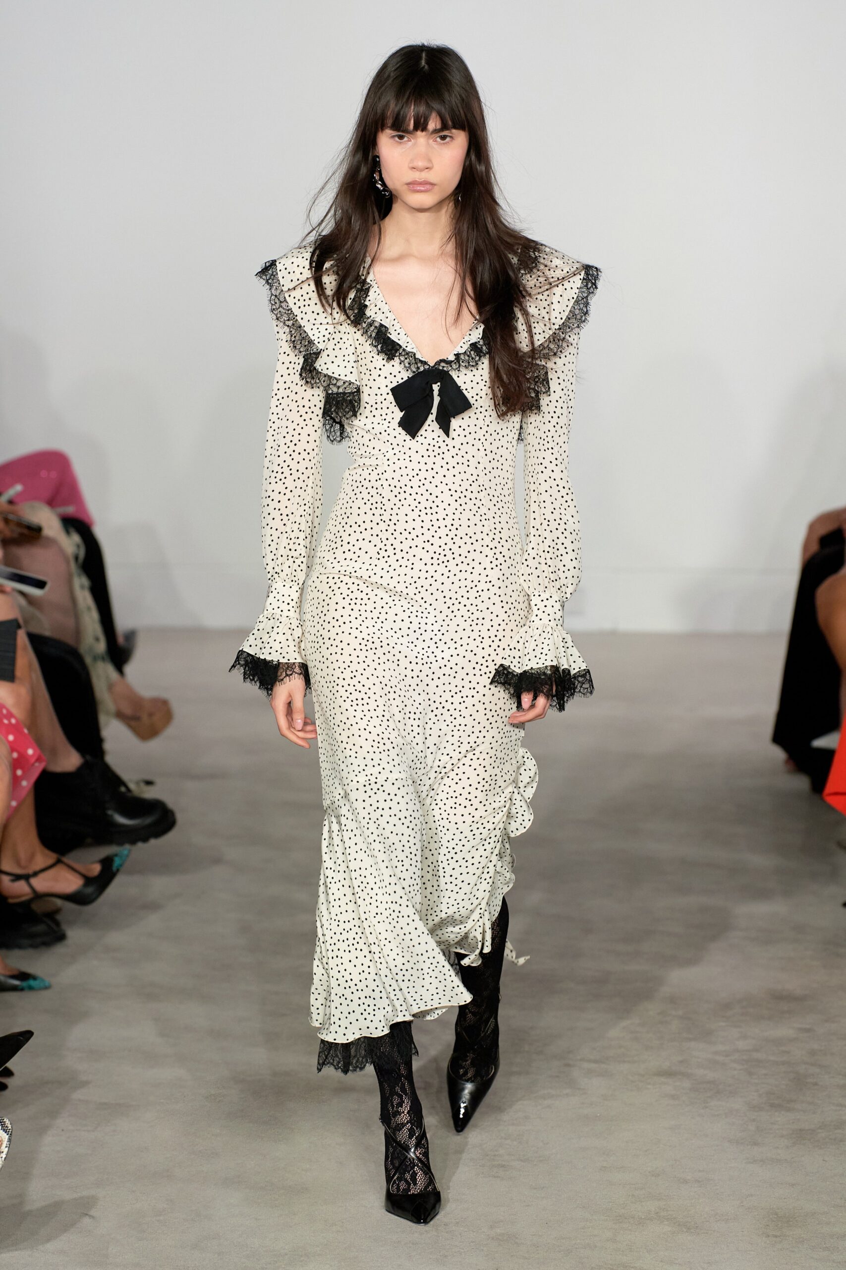 white polka-dot midi dress with black boots